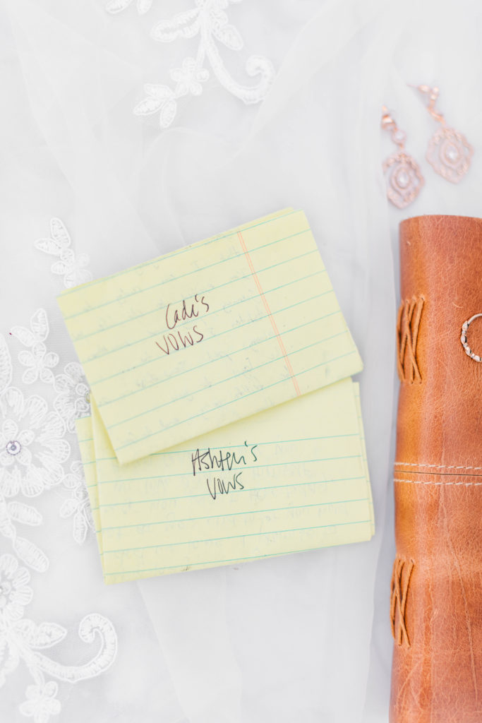 The bride and groom decided to write their vows on yellow college ruled paper. This was special to them because they met through writing each other notes on this same type of paper.